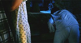 GIF of Hagrid brandishing his umbrella and giving Dudley a pig's tail